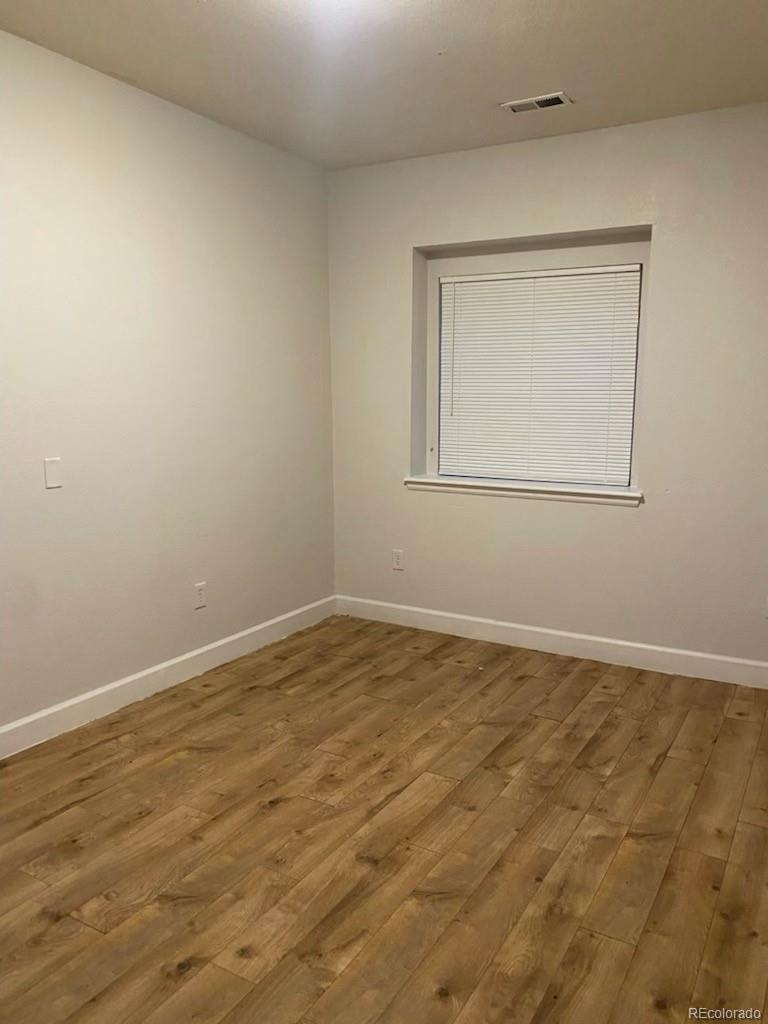 4582 West Alameda Avenue Denver, CO 80219 - Photo 15 of 17 an empty room with a window