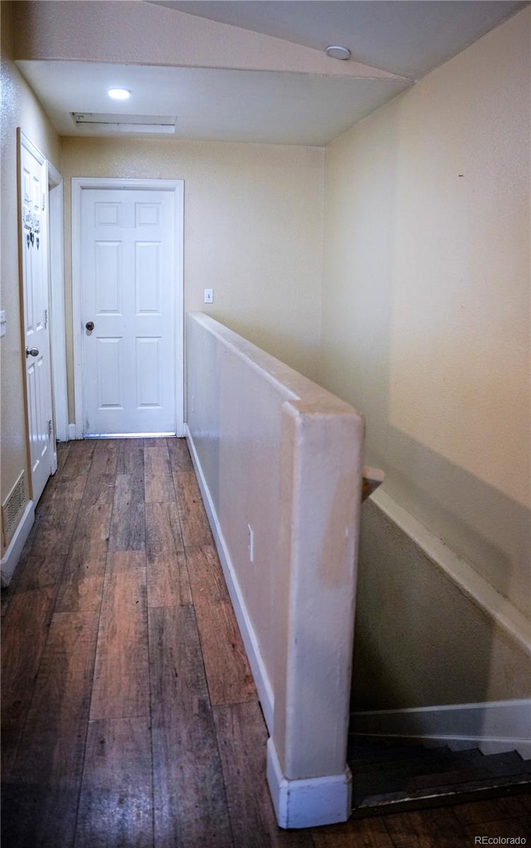 4582 West Alameda Avenue Denver, CO 80219 - Photo 5 of 17 a view of wooden cabinets