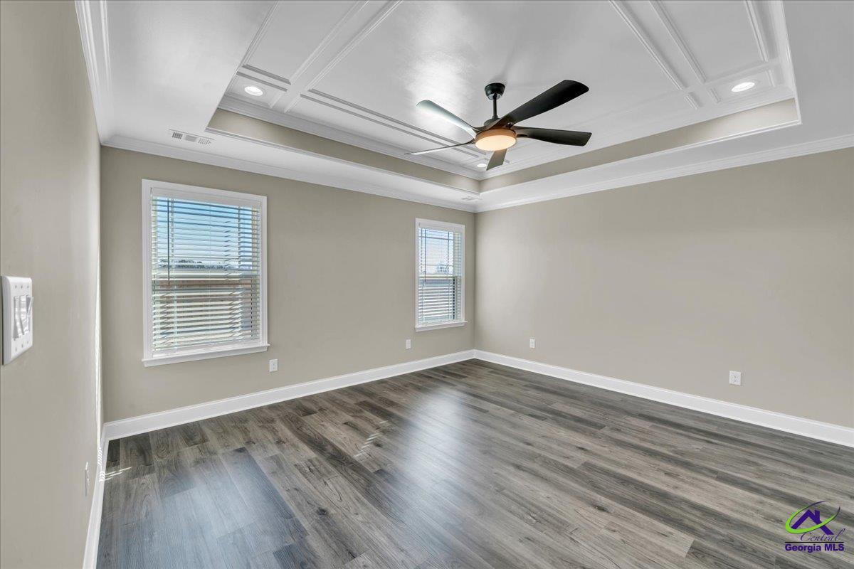 103 Early Drive Byron, GA 31008 - Photo 23 of 56 a view of an empty room with wooden floor and a window