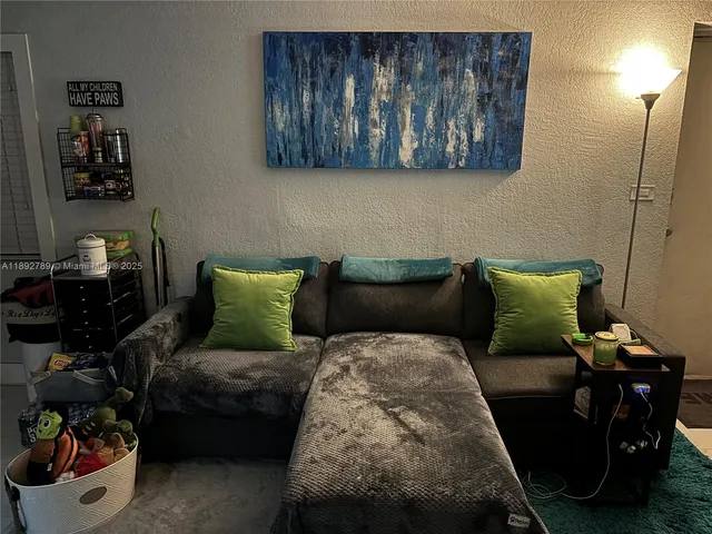 a bed room with furniture and a lamp