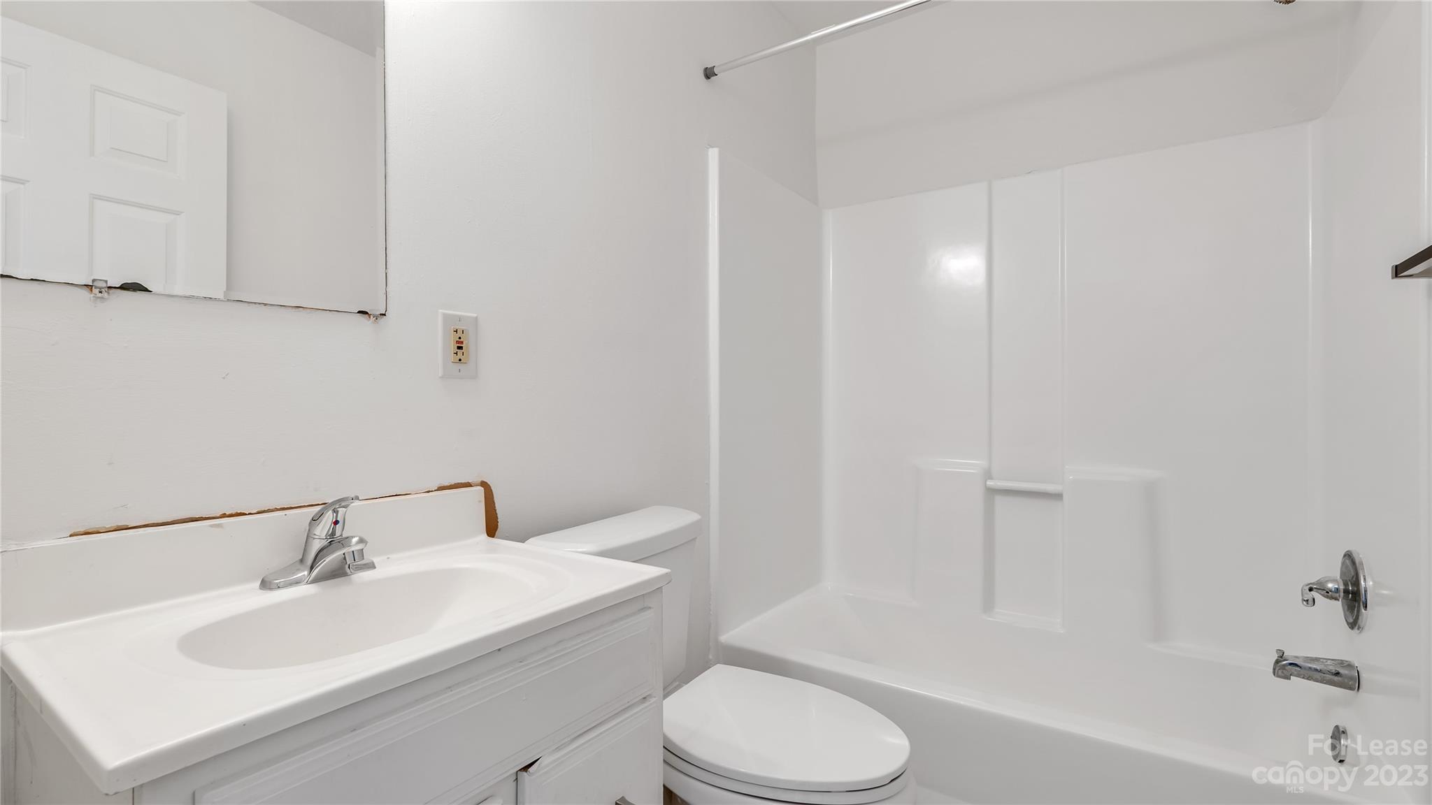 3733 Oakwood Road, Unit A Charlotte, NC 28269 - Photo 12 of 15 a bathroom with a sink toilet and bathtub