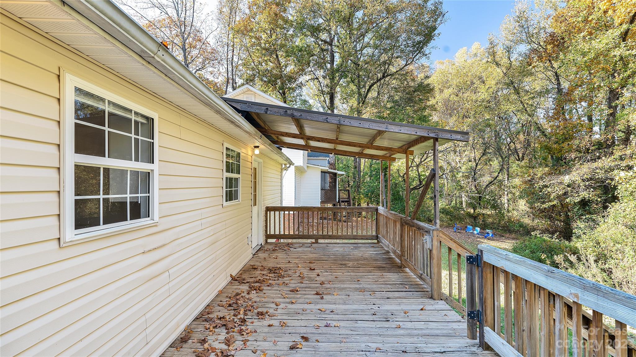3733 Oakwood Road, Unit A Charlotte, NC 28269 - Photo 14 of 15 a view of a house with a small deck