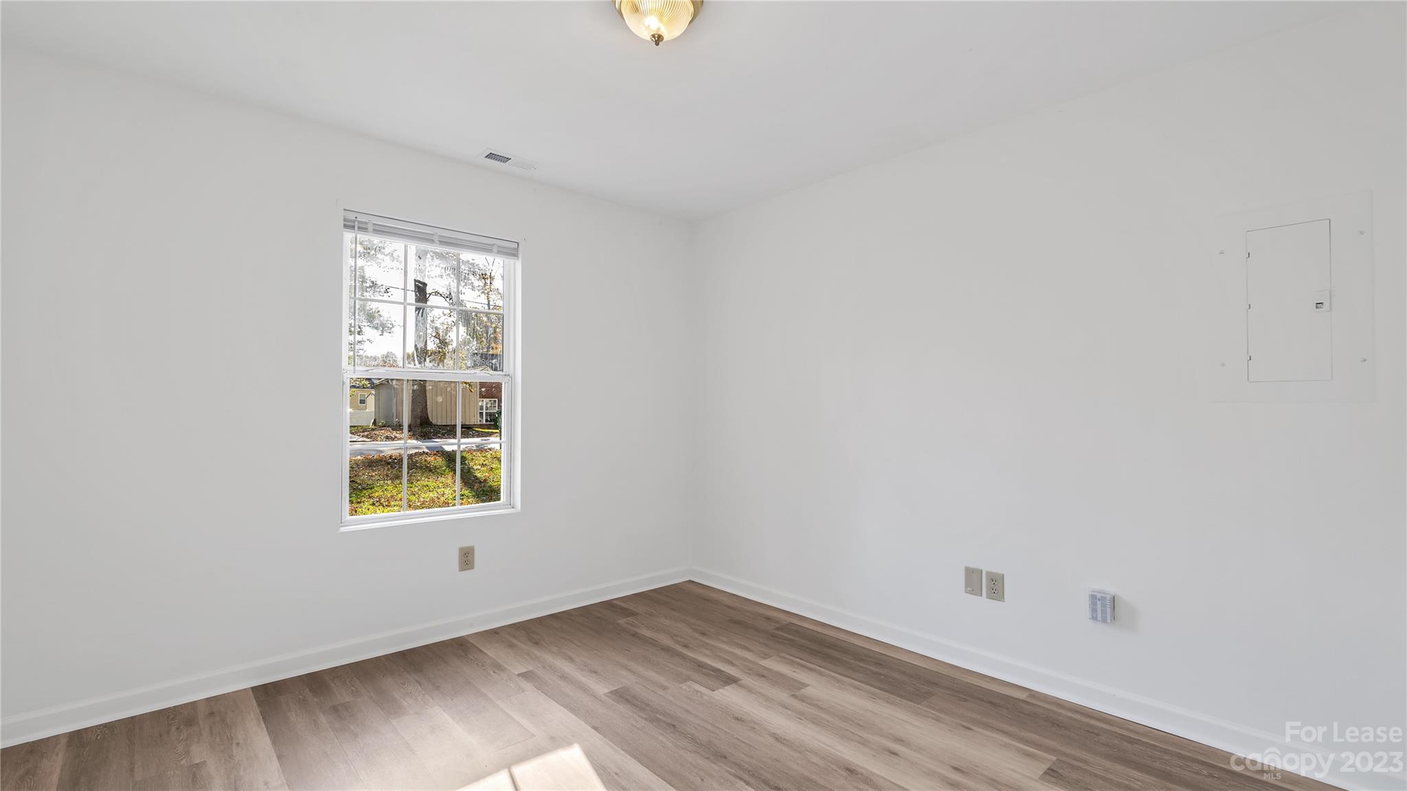 3733 Oakwood Road, Unit A Charlotte, NC 28269 - Photo 6 of 15 an empty room with a window