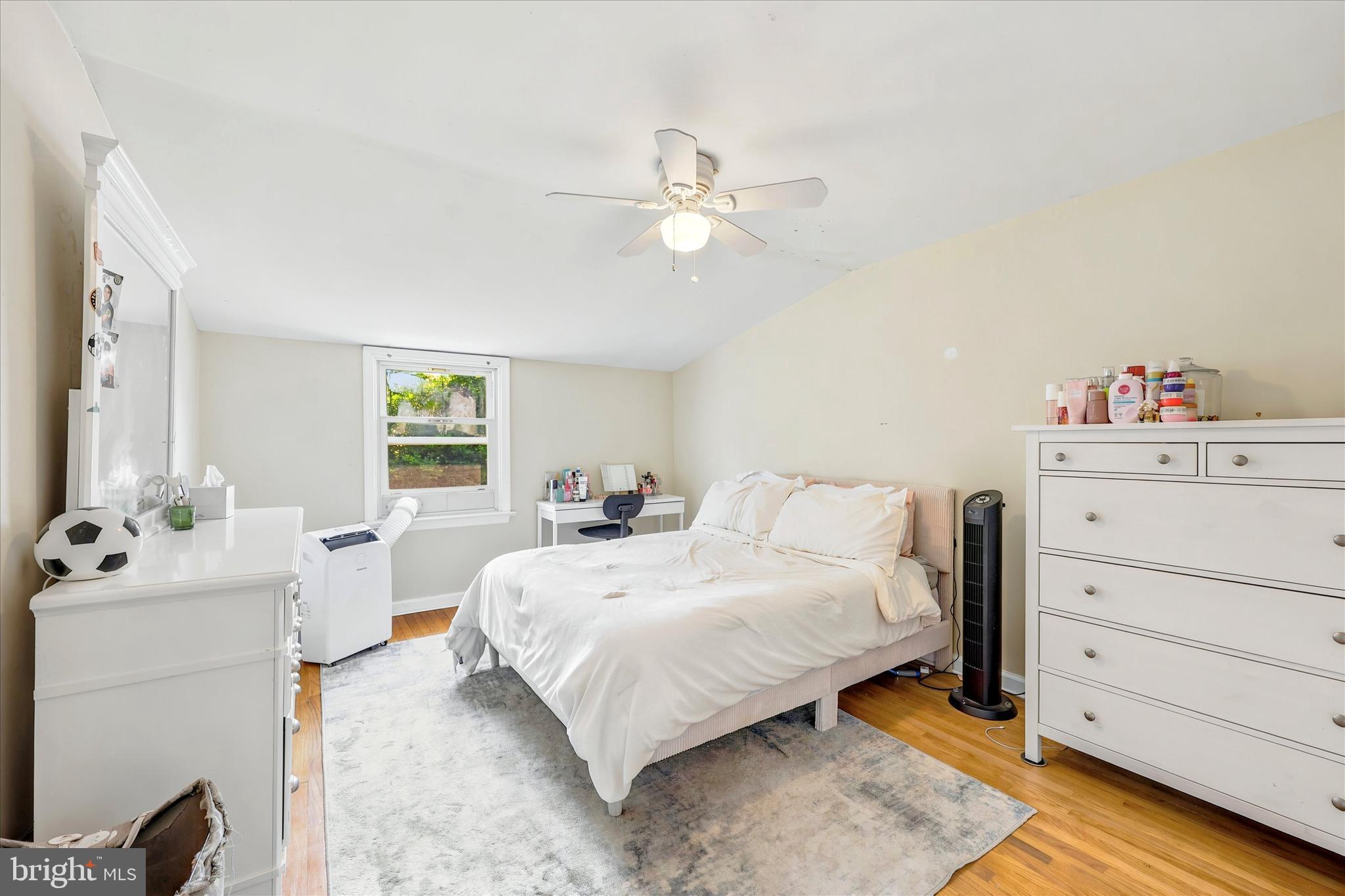 39 Haverford Road Ardmore, PA 19003 - Photo 20 of 24 a bedroom with a bed and a chandelier