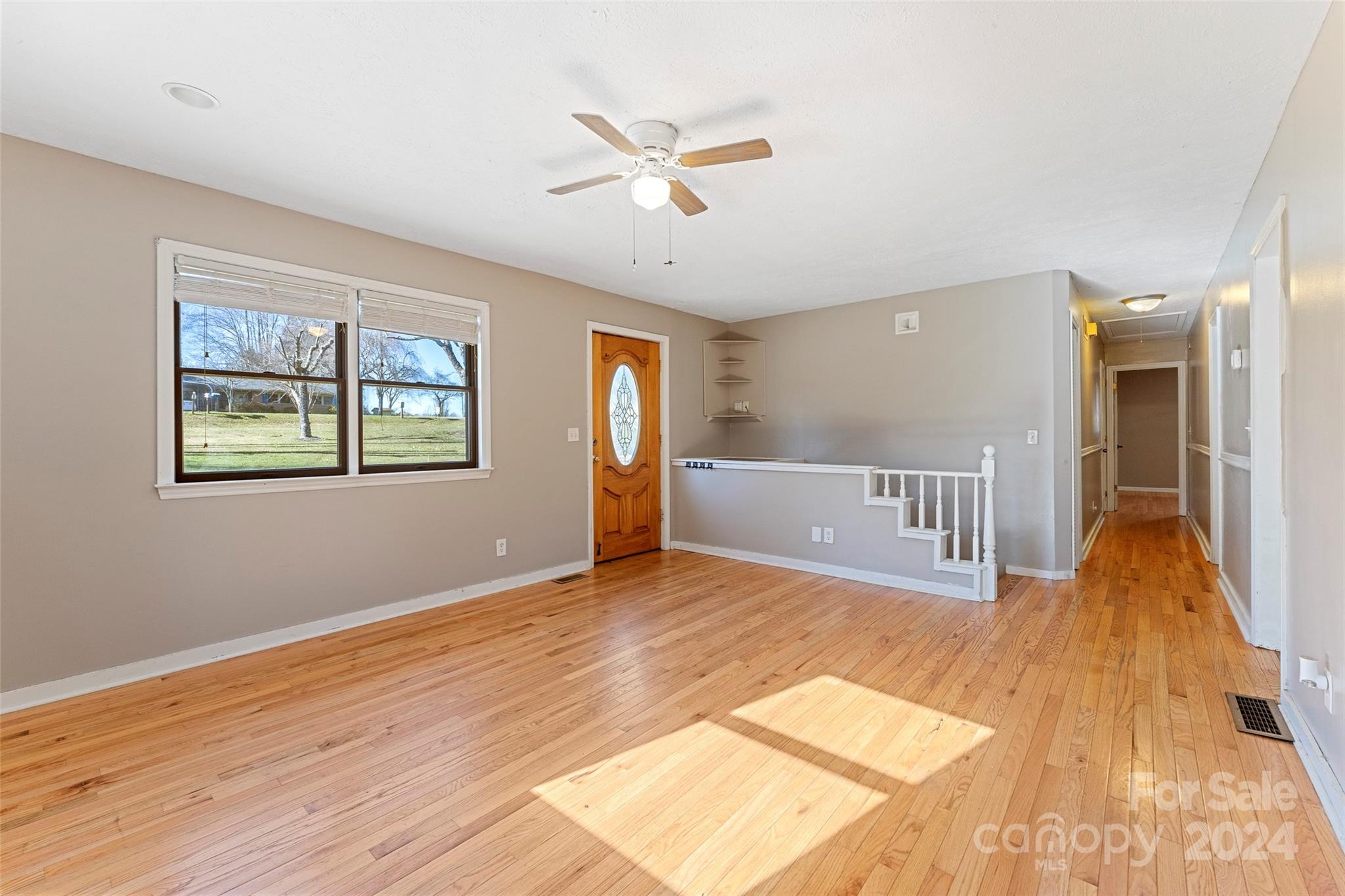 616 Oak Grove Road Flat Rock, NC 28731 - Photo 3 of 36 a view of livingroom with hardwood floor and a ceiling fan