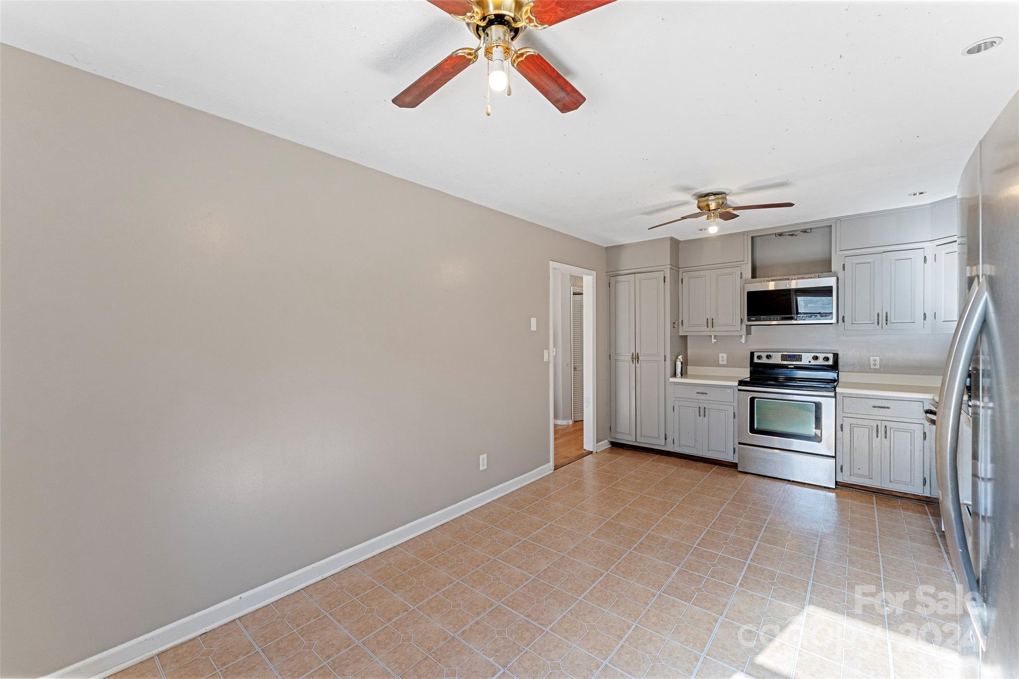 616 Oak Grove Road Flat Rock, NC 28731 - Photo 8 of 36 a view of kitchen with sink and refrigerator