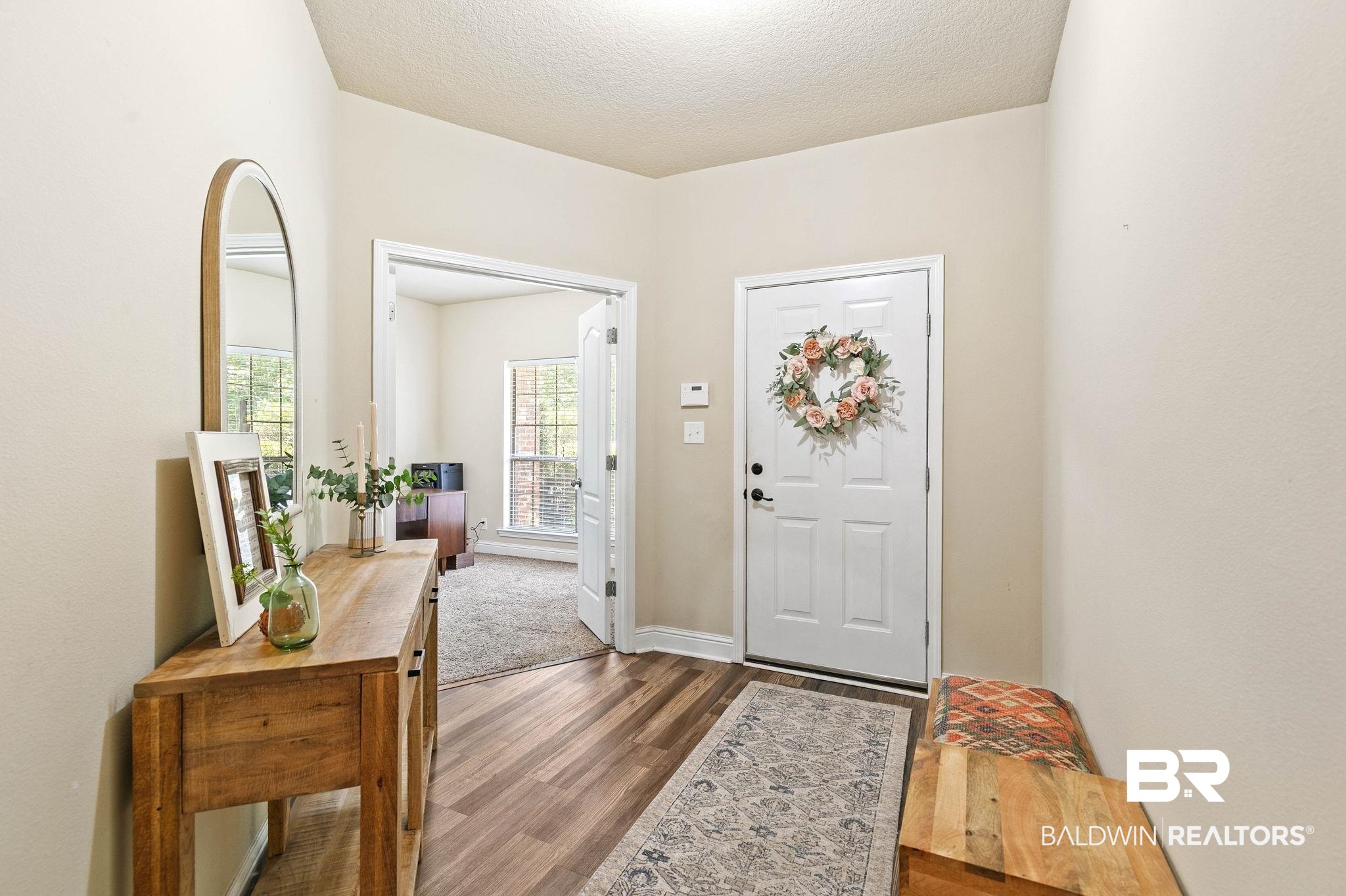 2216 Livingstone Court Mobile, AL 36695 - Photo 5 of 62 Entryway featuring wood-finish flooring, light neutral wall paint, and a white paneled door