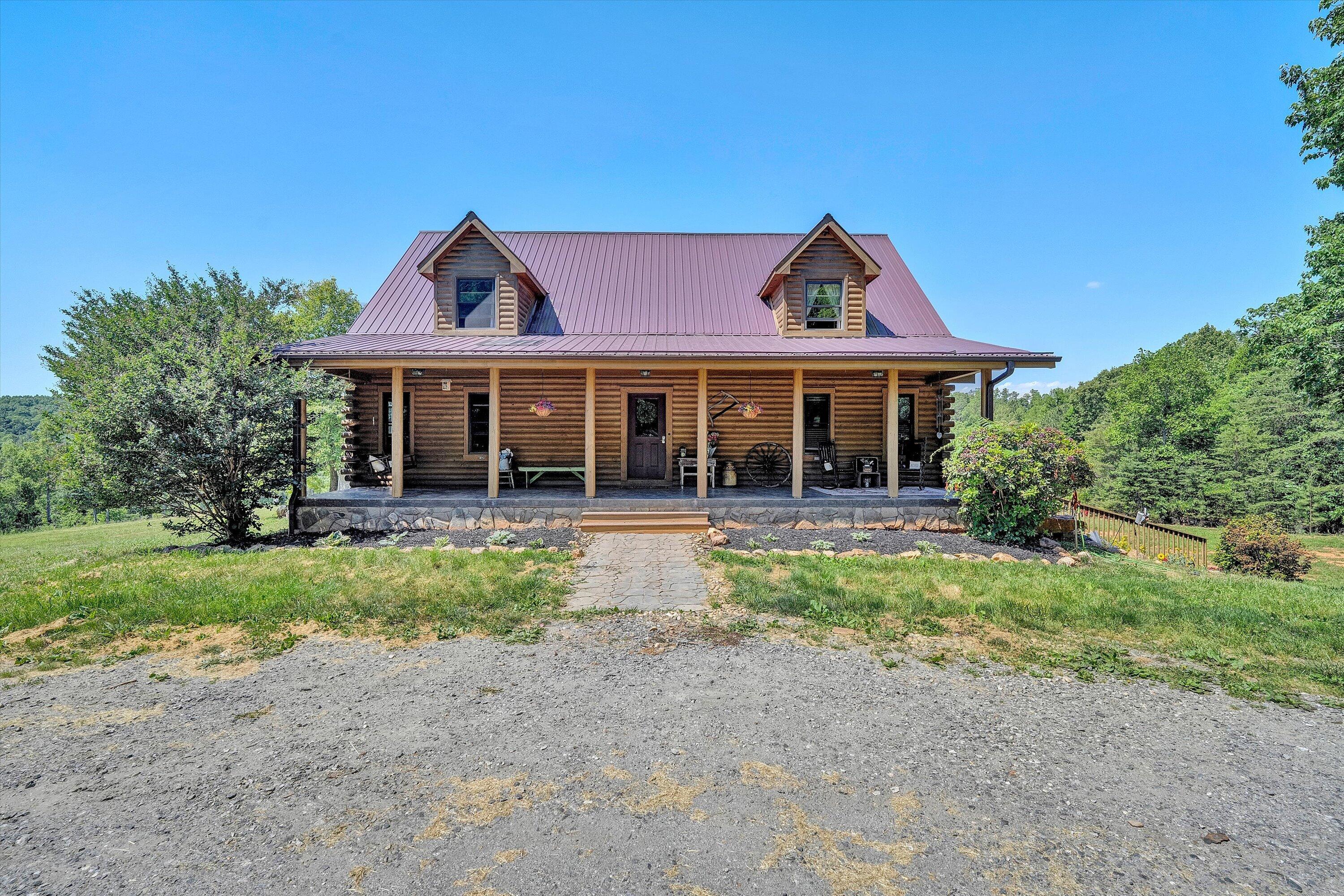 180 Thompson Ridge Circle Ferrum, VA 24088 - Photo 2 of 74 a front view of a house with yard and green space