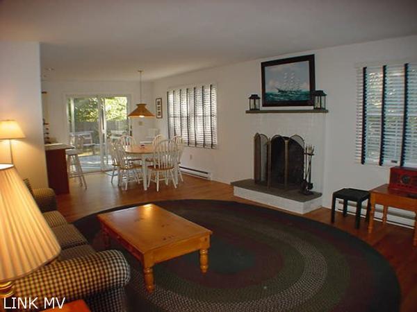 27 Vickers Street Edgartown, MA 02539 - Photo 3 of 5 a living room with furniture and a fireplace