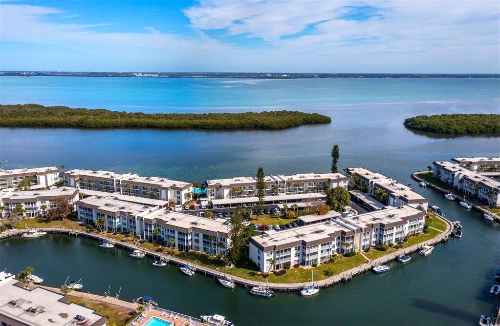 4430 Exeter Drive, Unit 106 Longboat Key, FL 34228 - Photo 2 of 57 an aerial view of a house with a lake view