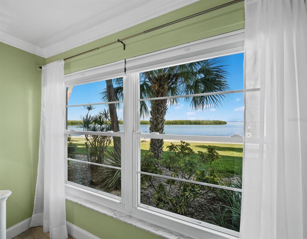 4430 Exeter Drive, Unit 106 Longboat Key, FL 34228 - Photo 22 of 57 a view of a glass door with a balcony