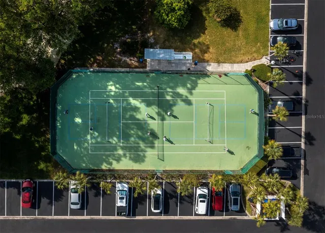 a view of a lake with boats and trees in the background