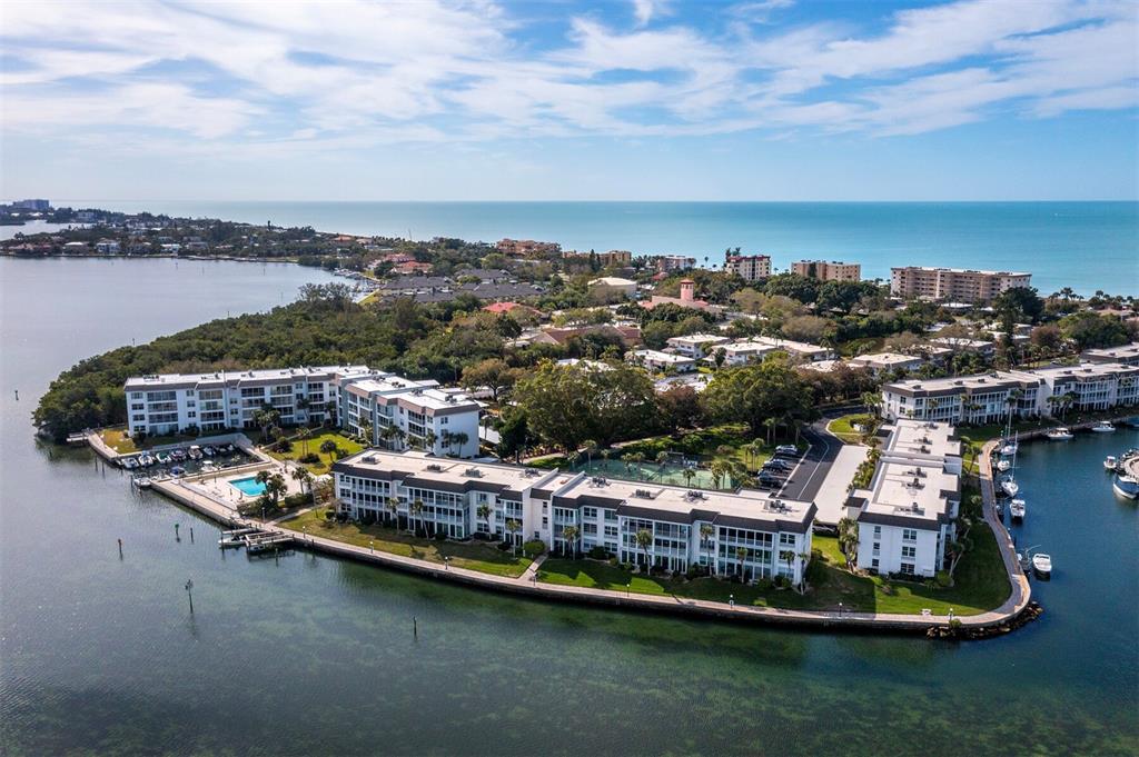 4430 Exeter Drive, Unit 106 Longboat Key, FL 34228 - Photo 28 of 57 a view of a lake with a city