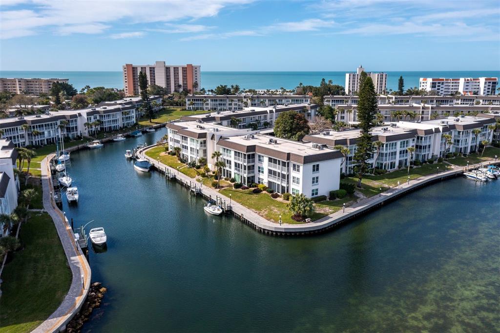 4430 Exeter Drive, Unit 106 Longboat Key, FL 34228 - Photo 29 of 57 a view of a lake with a city