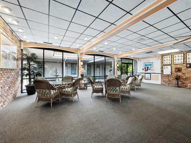 a room with wooden floor and a ceiling fan