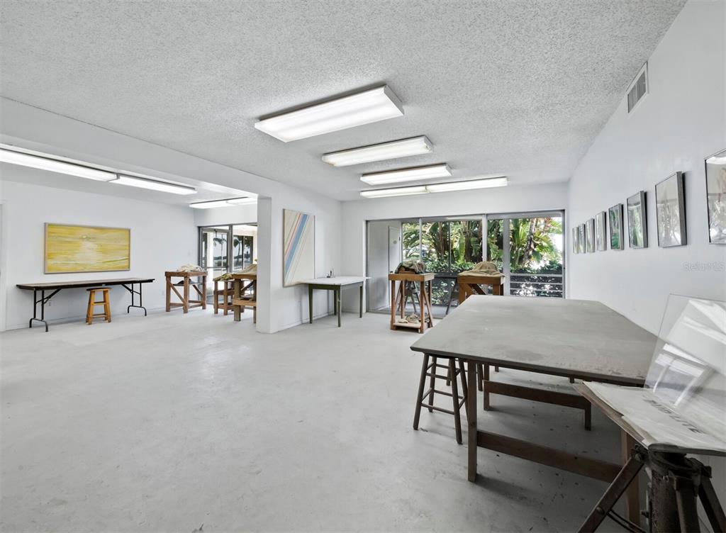 4430 Exeter Drive, Unit 106 Longboat Key, FL 34228 - Photo 48 of 57 a living room with furniture and a table