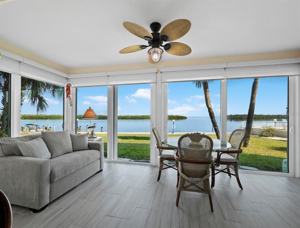 4430 Exeter Drive, Unit 106 Longboat Key, FL 34228 - Photo 9 of 57 a living room with furniture and a large window
