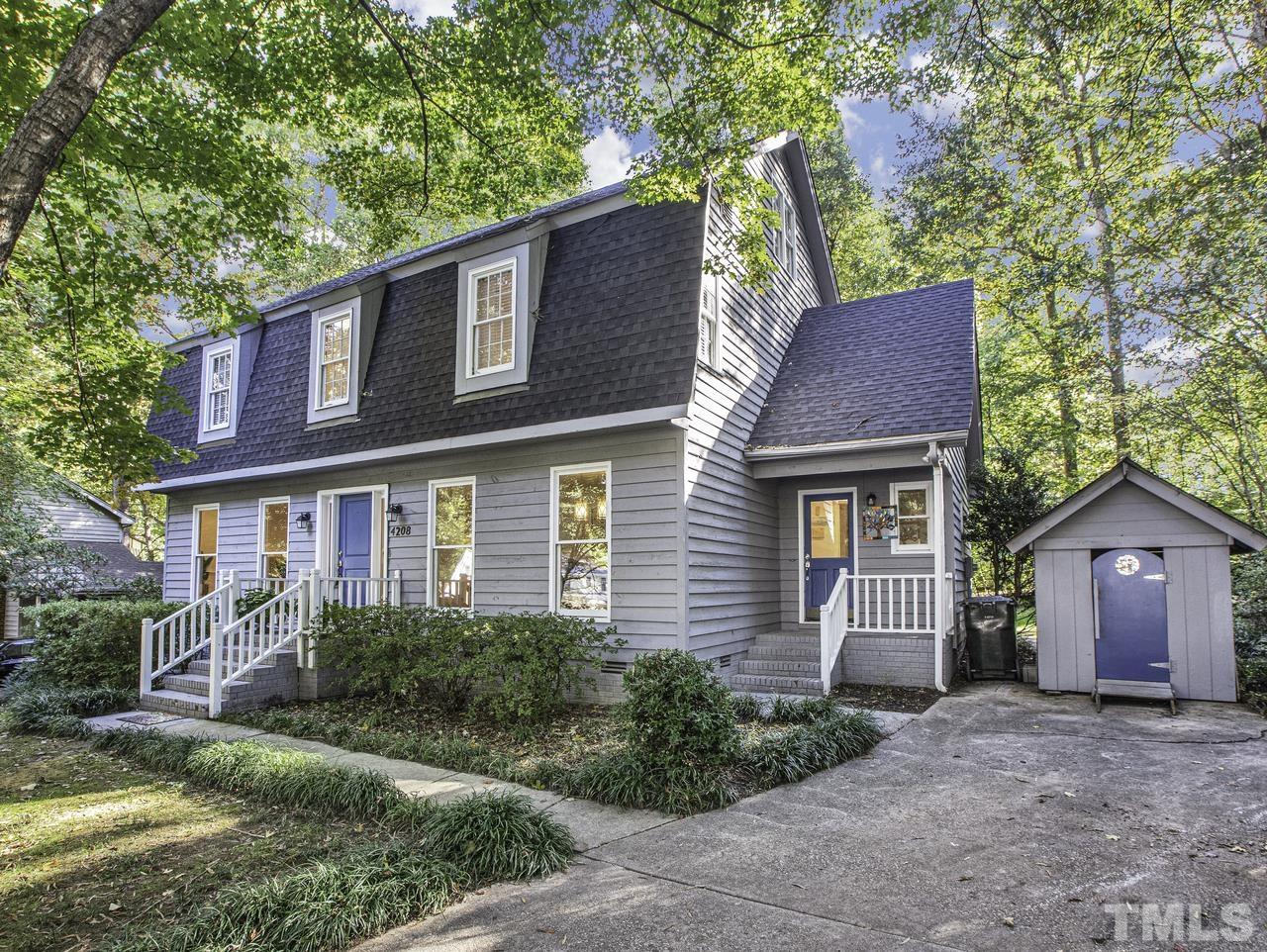 4208 Webster Court Raleigh, NC 27609 - Photo 2 of 28 a view of a house with a yard plants and large tree