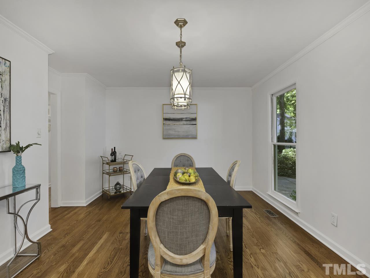 4208 Webster Court Raleigh, NC 27609 - Photo 11 of 28 a view of a dining room with furniture window and wooden floor