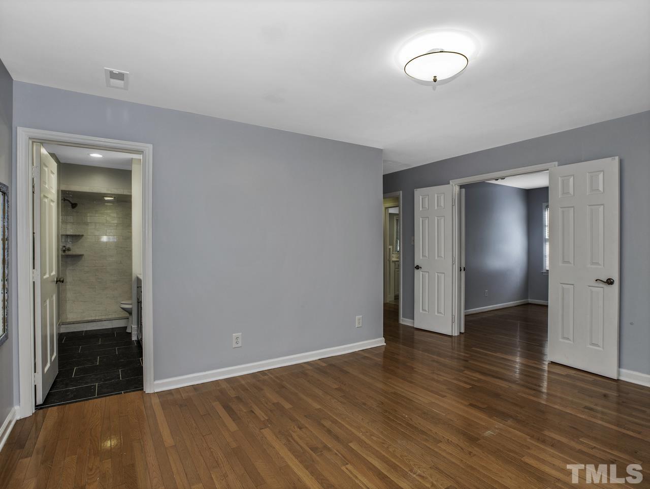 4208 Webster Court Raleigh, NC 27609 - Photo 13 of 28 a view of an empty room with wooden floor and closet