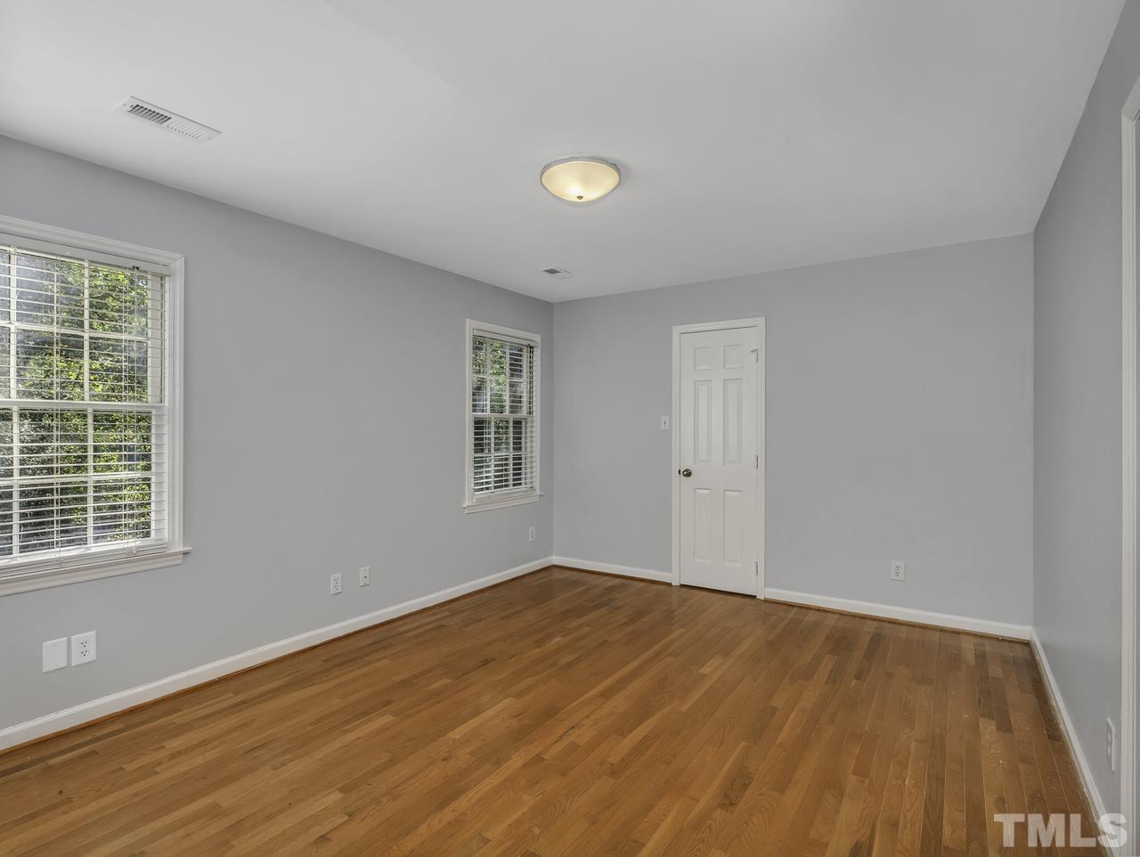 4208 Webster Court Raleigh, NC 27609 - Photo 16 of 28 a view of empty room with wooden floor and fan