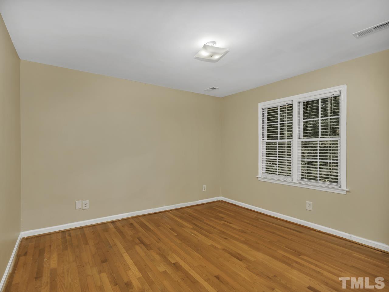 4208 Webster Court Raleigh, NC 27609 - Photo 19 of 28 an empty room with a window