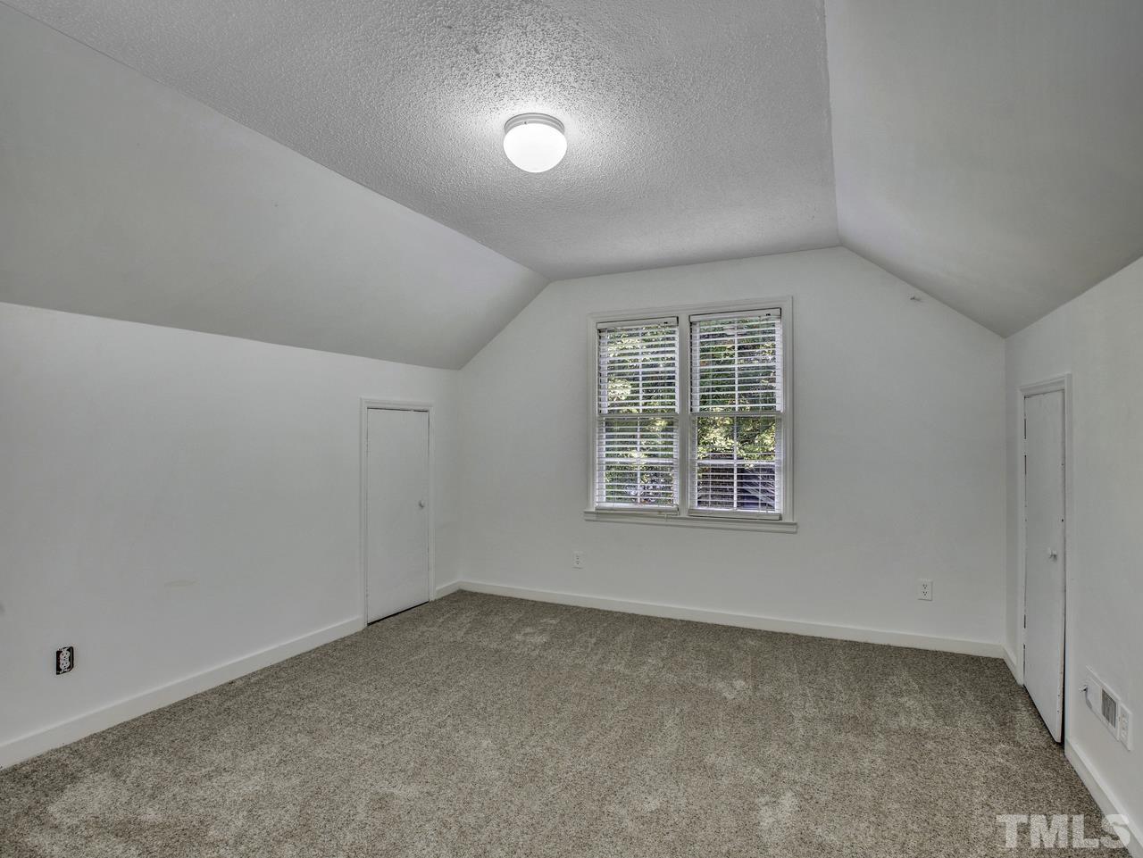 4208 Webster Court Raleigh, NC 27609 - Photo 20 of 28 an empty room with a window