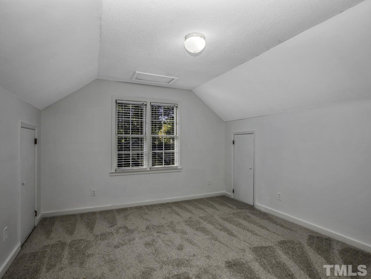 4208 Webster Court Raleigh, NC 27609 - Photo 22 of 28 an empty room with a window