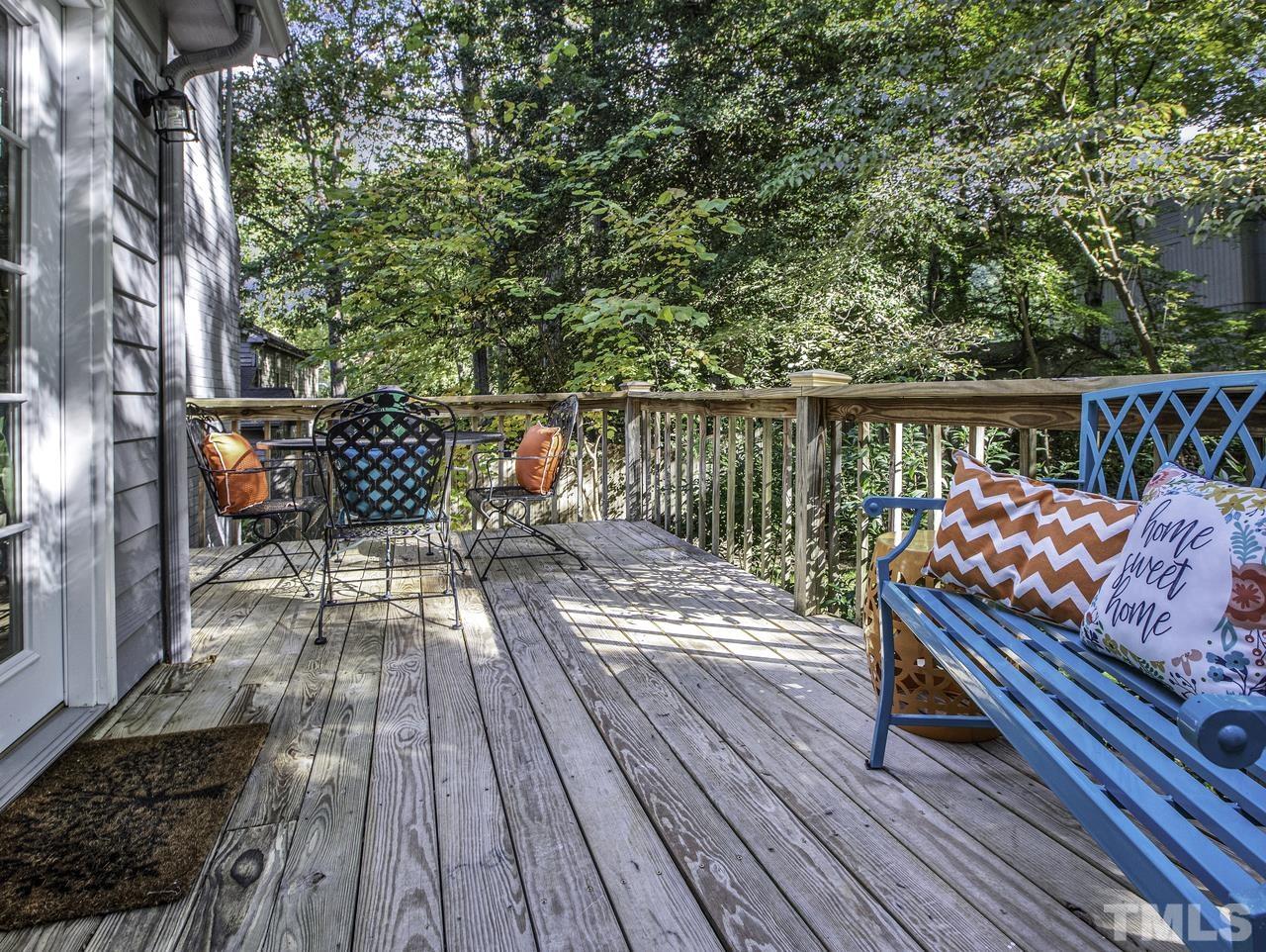 4208 Webster Court Raleigh, NC 27609 - Photo 25 of 28 a balcony with wooden floor and outdoor seating