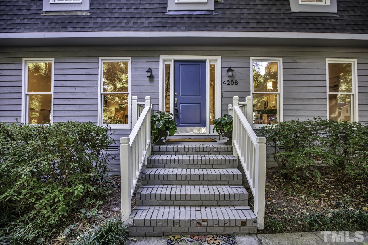 4208 Webster Court Raleigh, NC 27609 - Photo 26 of 28 a front view of a house with a garden