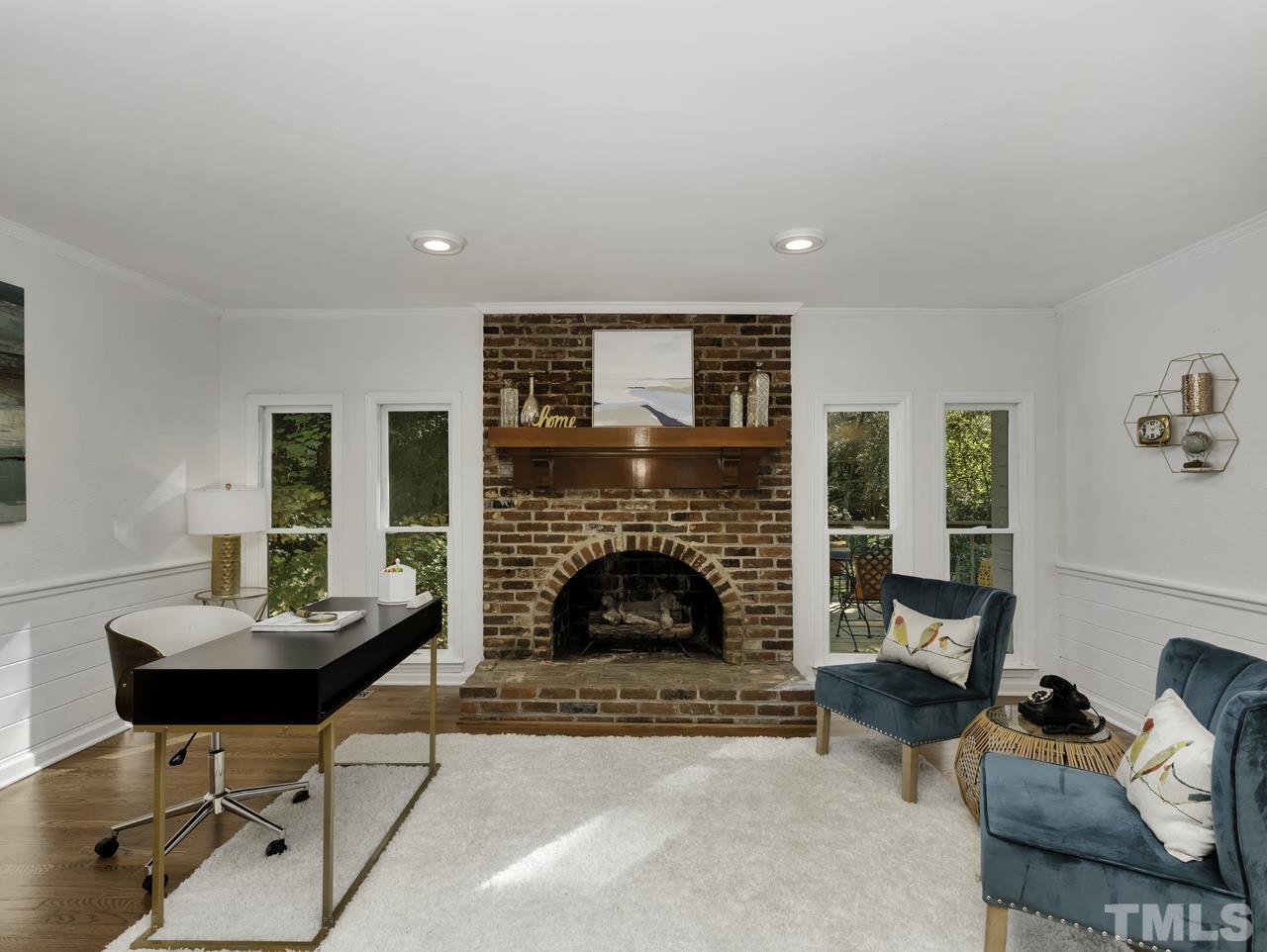 4208 Webster Court Raleigh, NC 27609 - Photo 4 of 28 a living room with furniture and a fireplace