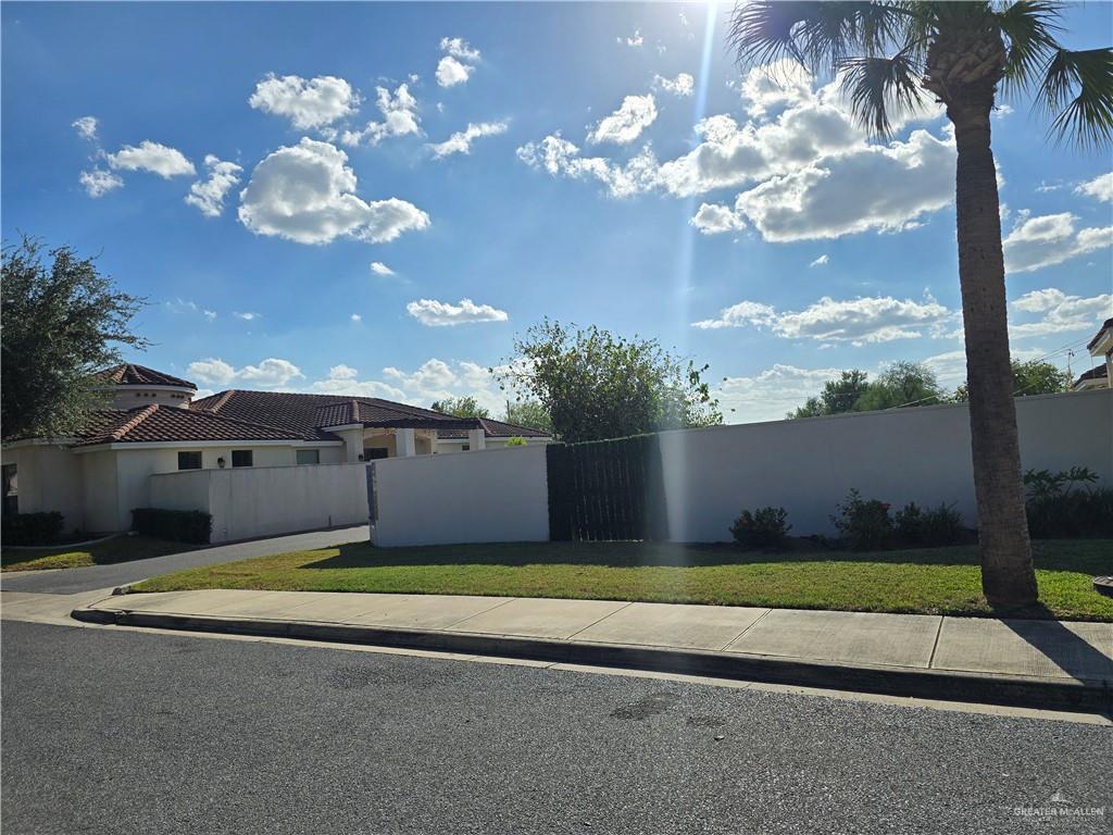 3416 South "M" Street McAllen, TX 78503 - Photo 1 of 2 a view of a fountain in front of a house