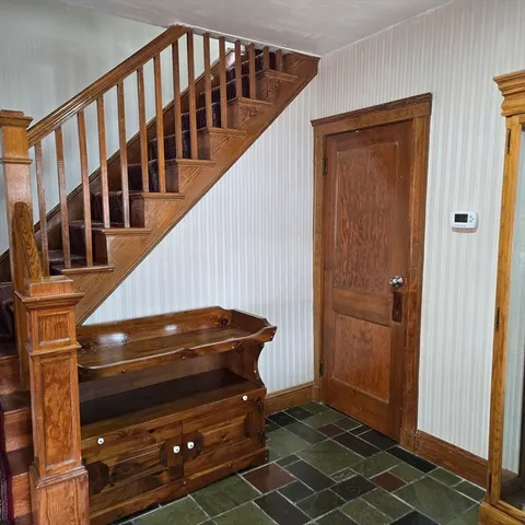 a view of entryway with a front door