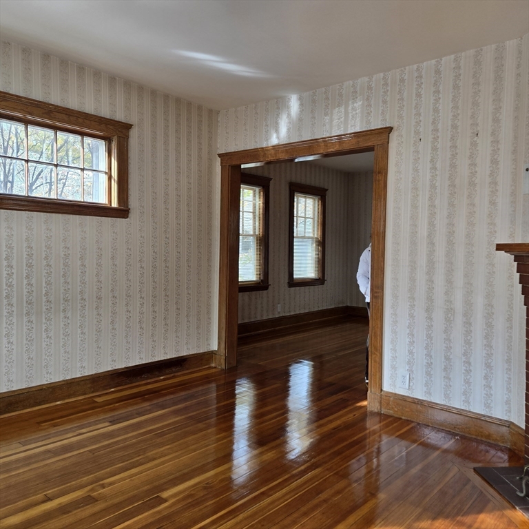 22 Hope Avenue, Unit 22 Milton, MA 02186 - Photo 5 of 36 a view of hallway with wooden floor and stairs
