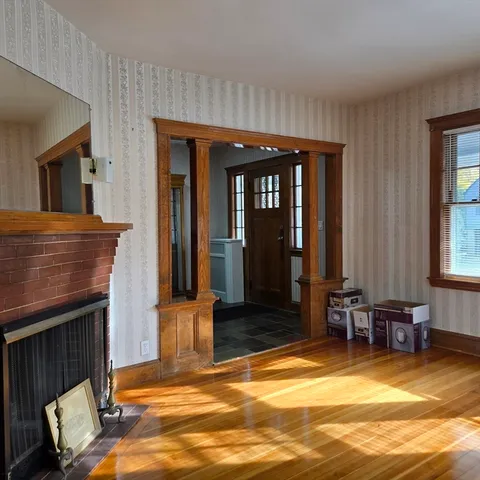 a view of livingroom with furniture window and front door