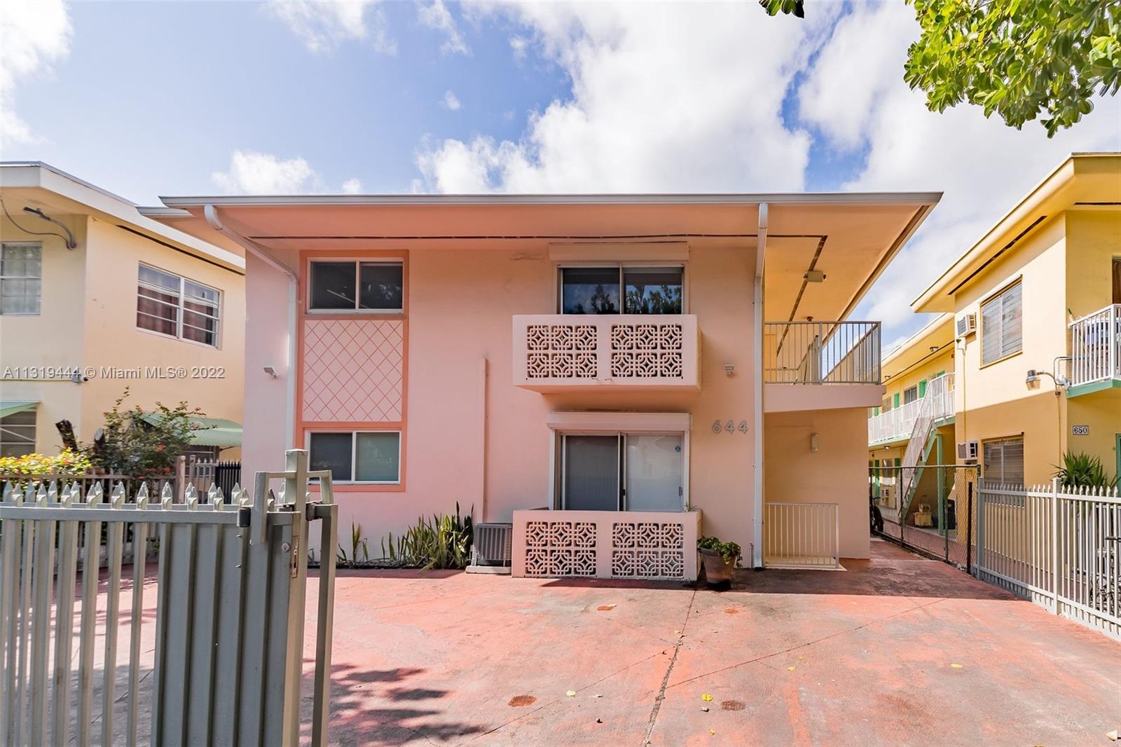 644 Meridian Avenue, Unit 8 Miami Beach, FL 33139 - Photo 1 of 13 a front view of a house with a yard