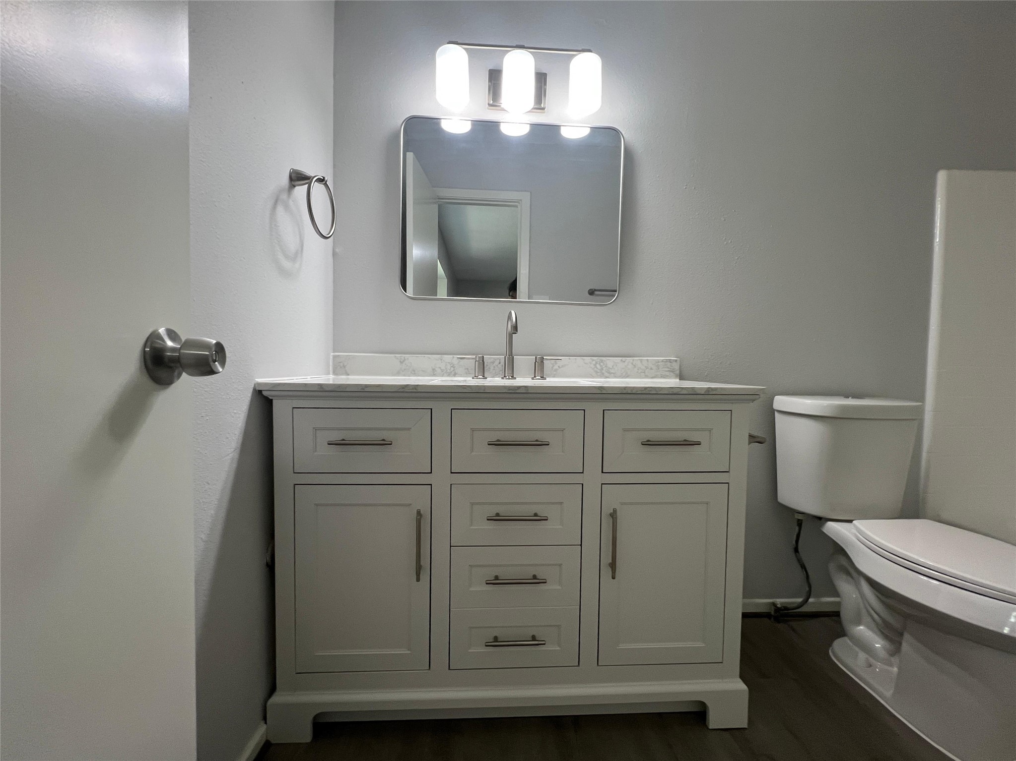 7012 Jetty Lane Houston, TX 77072 - Photo 11 of 24 a bathroom with a granite countertop toilet sink and mirror