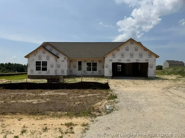 a view of a house with a yard swimming pool and a yard