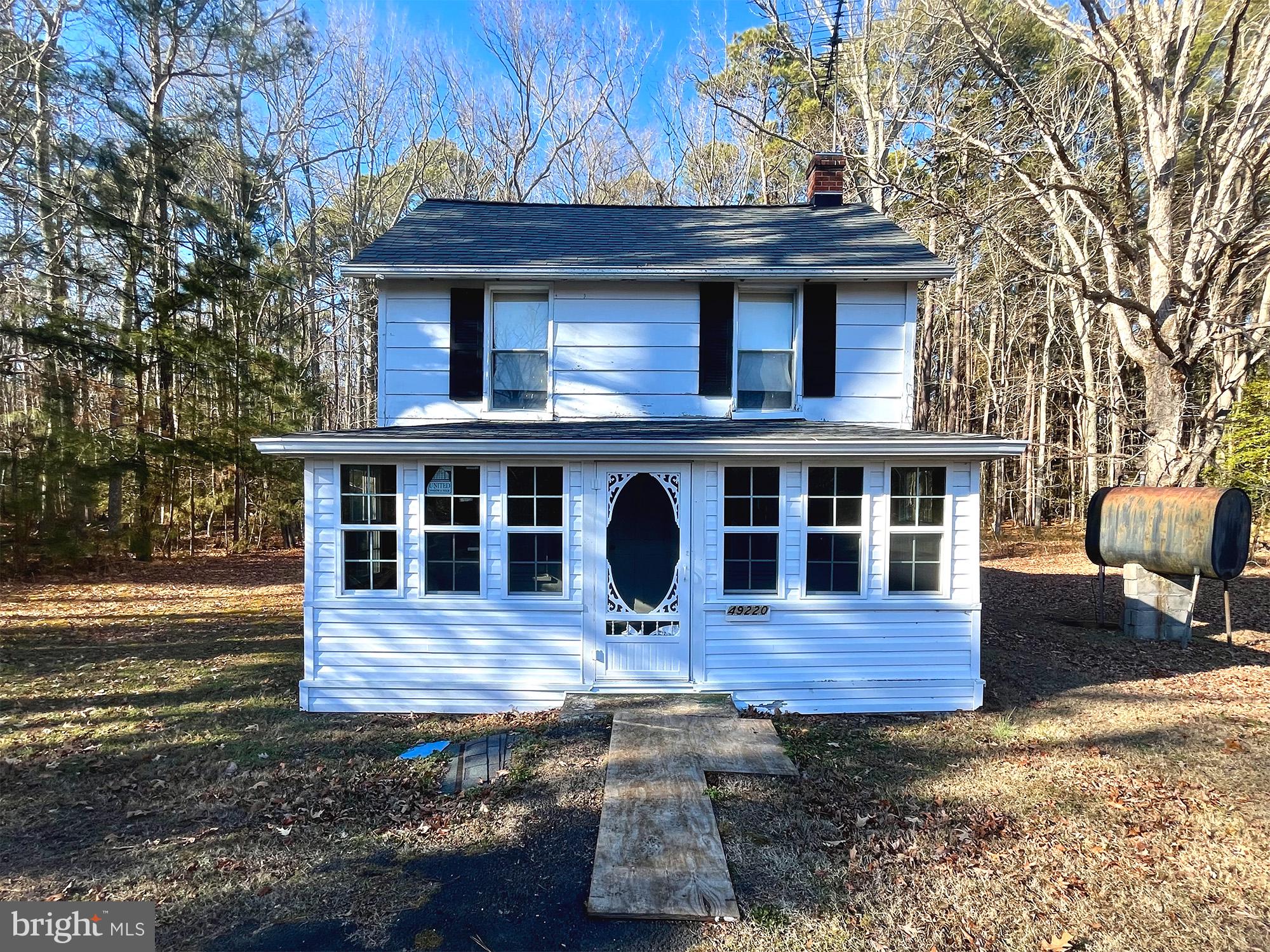 49220 Curleys Road Ridge, MD 20680 - Photo 1 of 24 a front view of a house with yard