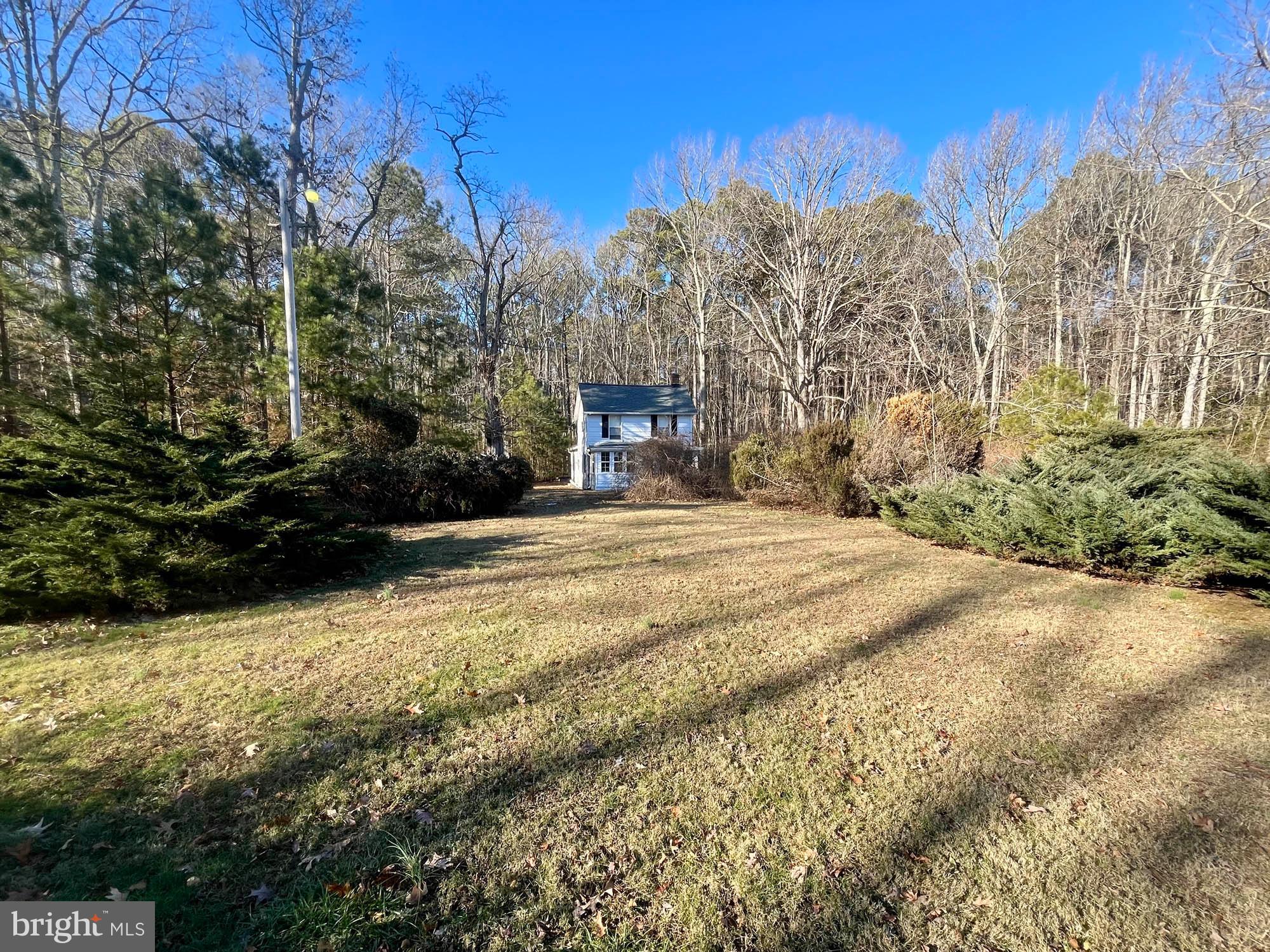 49220 Curleys Road Ridge, MD 20680 - Photo 11 of 24 a view of a house with a yard covered with snow