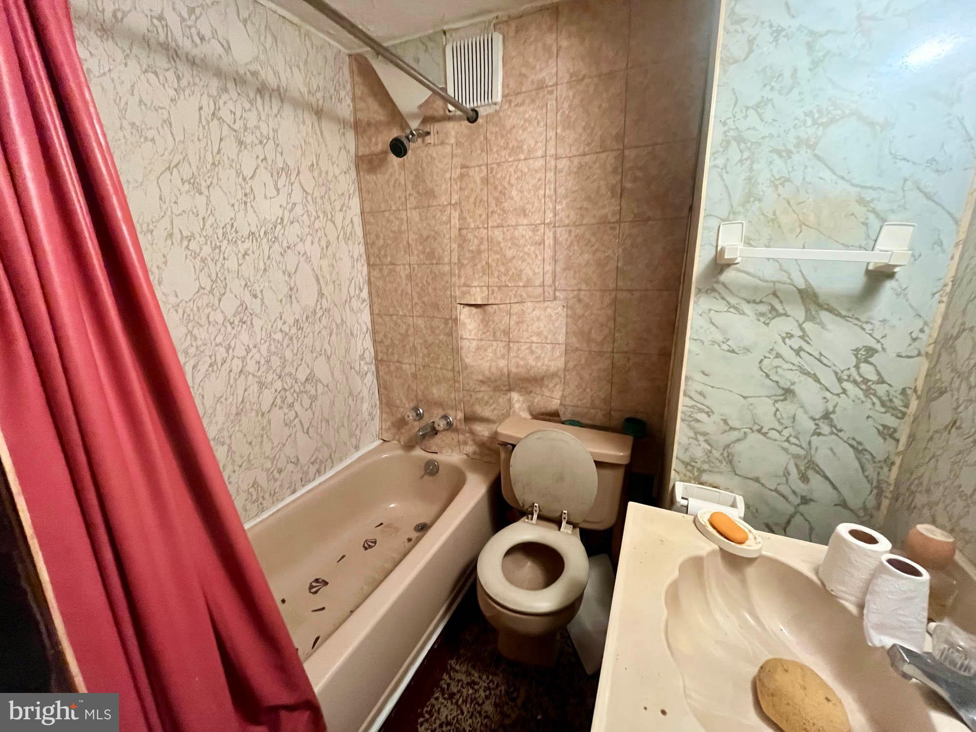 49220 Curleys Road Ridge, MD 20680 - Photo 23 of 24 a bathroom with a sink and a tub
