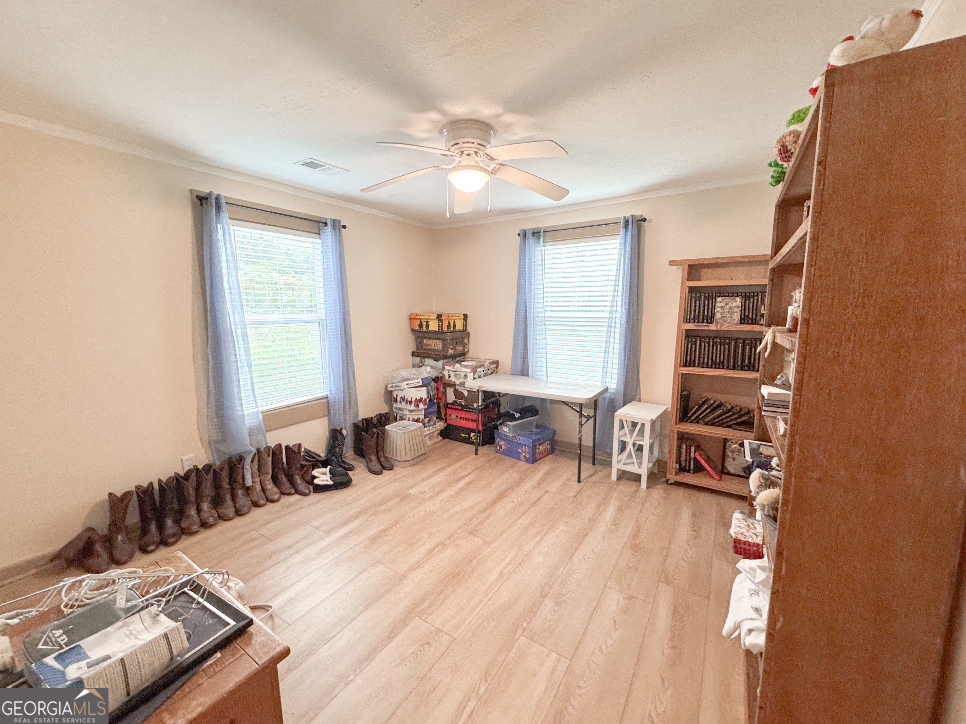 12 Bailey Drive Newnan, GA 30263 - Photo 22 of 35 a bed room with a bed and a chair