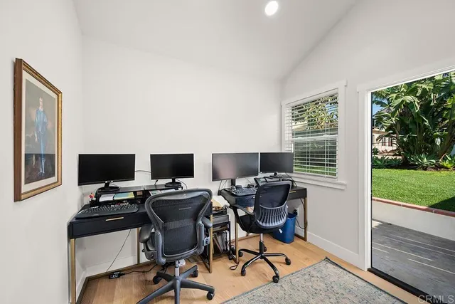a view of a white house with a large windows