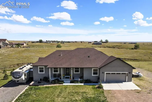 a aerial view of a house with a ocean view