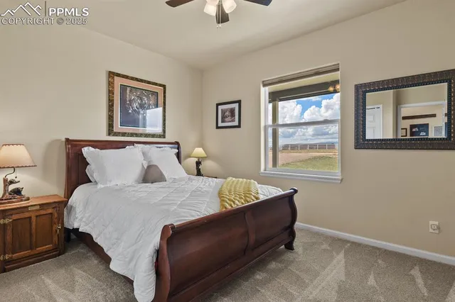 a bedroom with bed and window