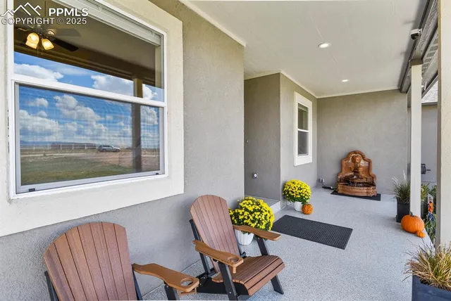 a living room with furniture and a chair