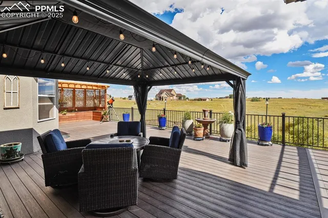 a view of a patio with wooden floor