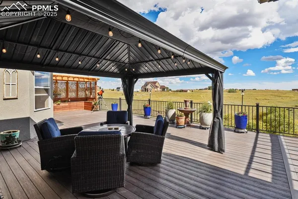 a view of a patio with wooden floor