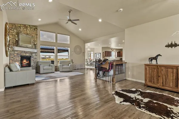 a living room with furniture and fireplace