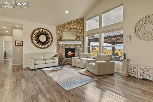 a living room with furniture a fireplace and a table